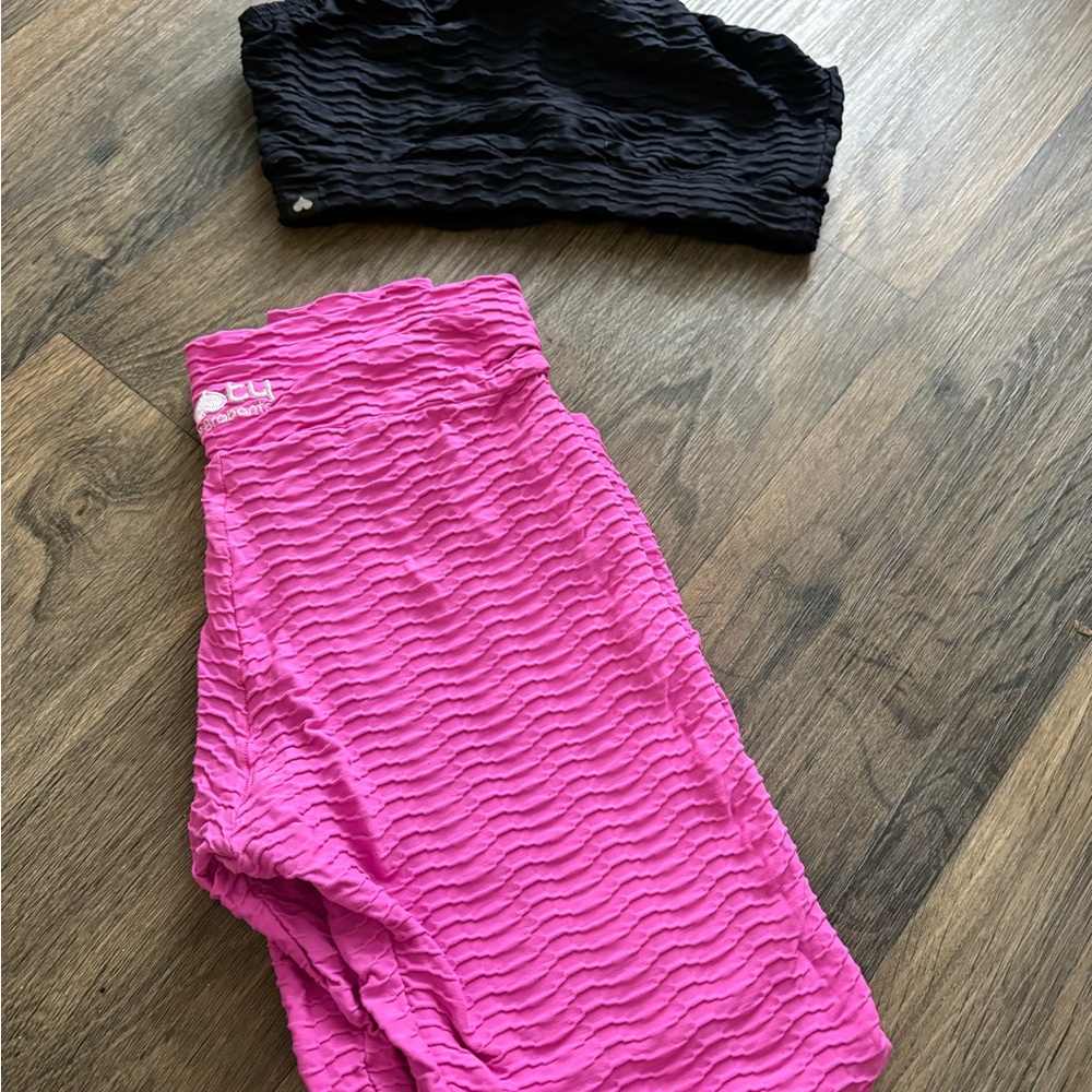 Pink leggings and black sports bra